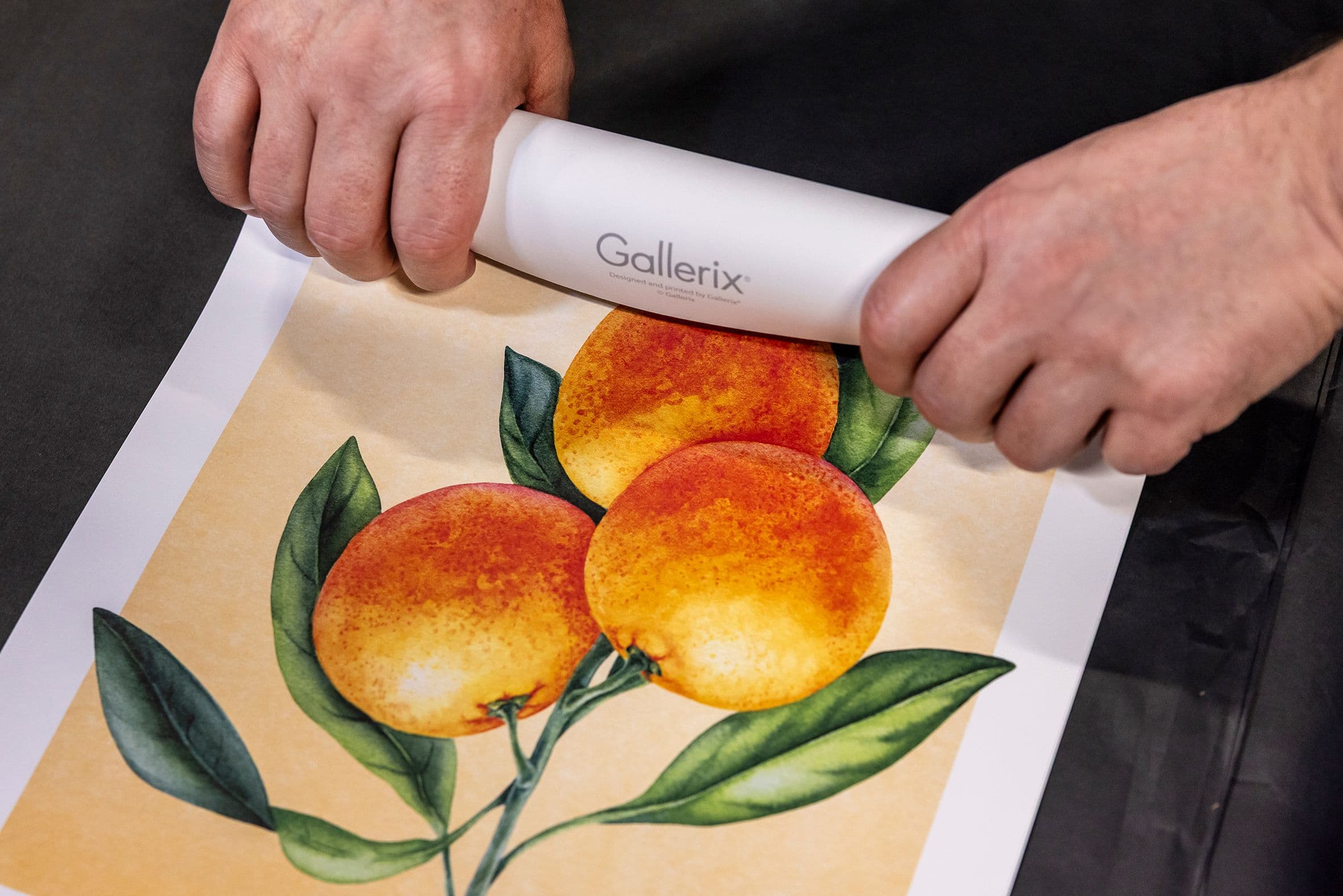 rolling a poster with oranges