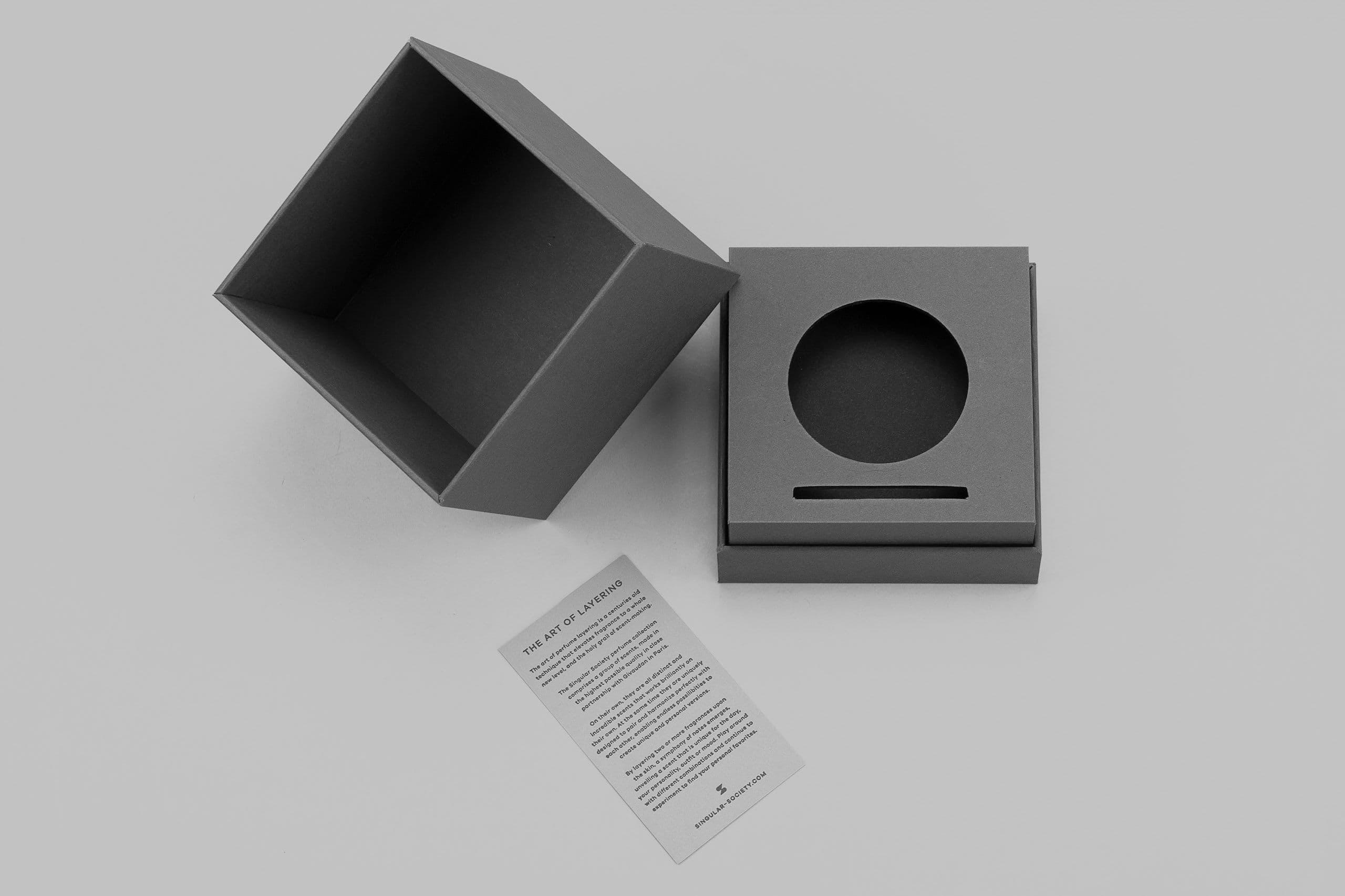 Exclusive rigid boxes for perfumes with a foil stamped sleeve.