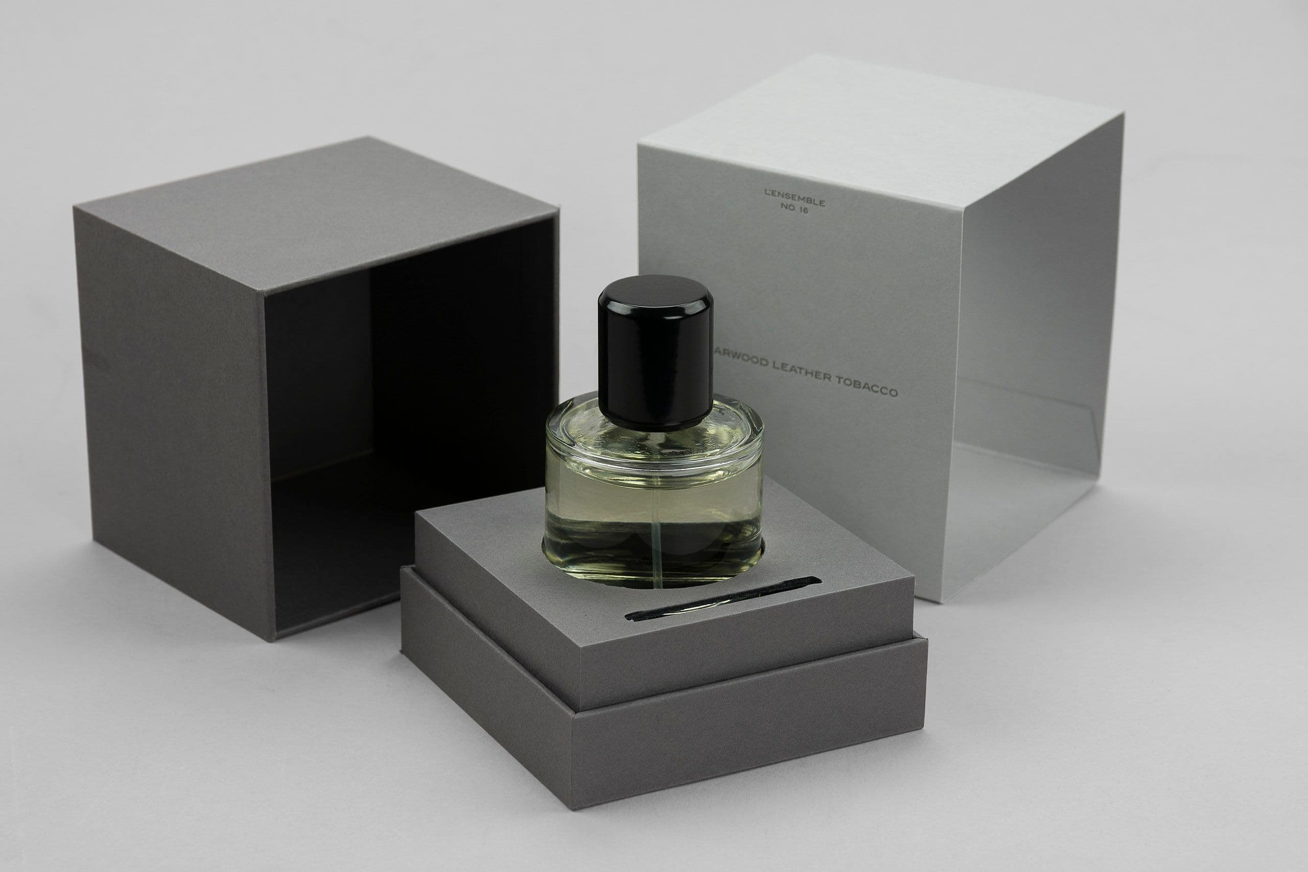 Exclusive rigid boxes for perfumes with a foil stamped sleeve.