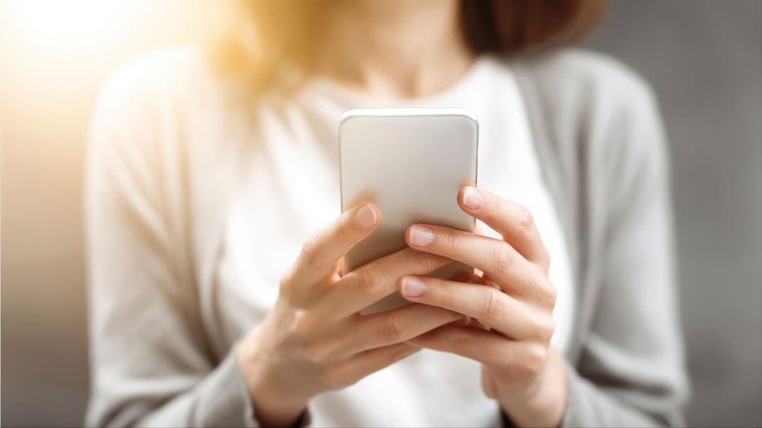 Woman holding a phone in her hands
